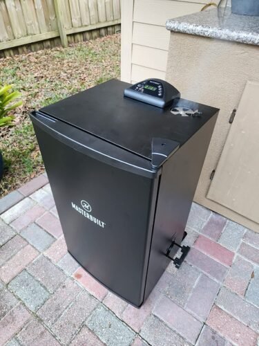 Masterbuilt 30-Inch Digital Electric Vertical Smoker – 710 Sq In Cooking Area, Side Wood Chip Loader, Digital Controls, Chrome Racks & Leg Kit – Model MB20070421, Black photo review
